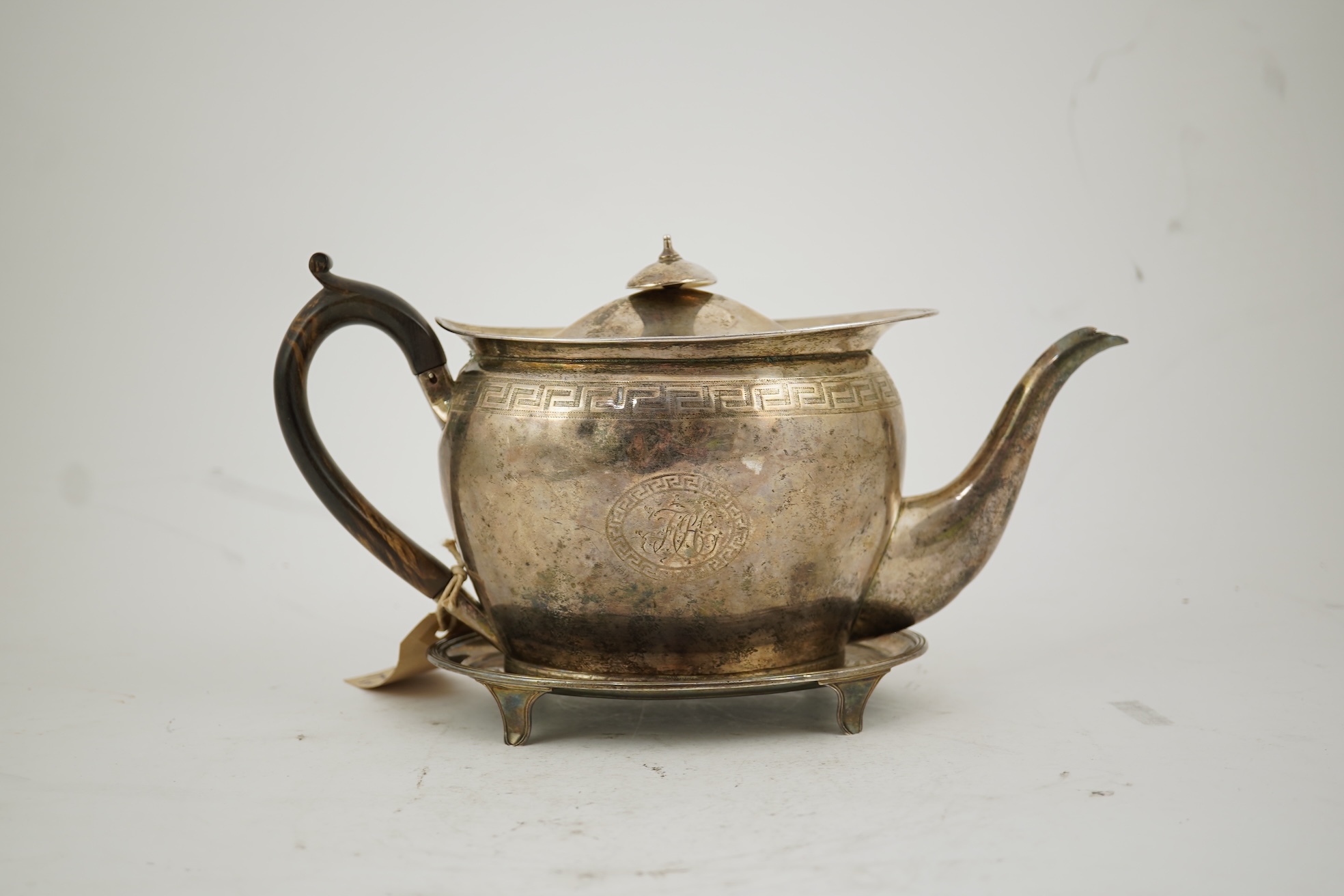 A George III silver oval teapot and matching oval stand, by John Eames